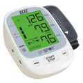 A Poct brand BP Spot digital upper arm blood pressure monitor with a white casing, gray cuff, and a bright green display screen showing readings.