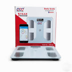 A white digital body scale with four sensor pads and a small display, shown in front of its retail box. The packaging is white and red with a phone app graphic and text including 'Body Scale' and 'Bluetooth'.
