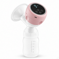 A digital breast pump with a pink and white design, featuring a clear breast shield, clear bottle, and a digital display screen on the top, shown against a white background.